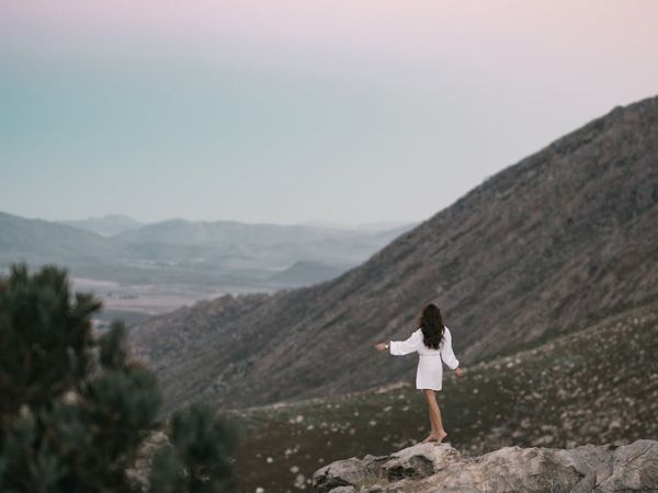 Person looking at a bright, clear landscape with a sense of wonder.